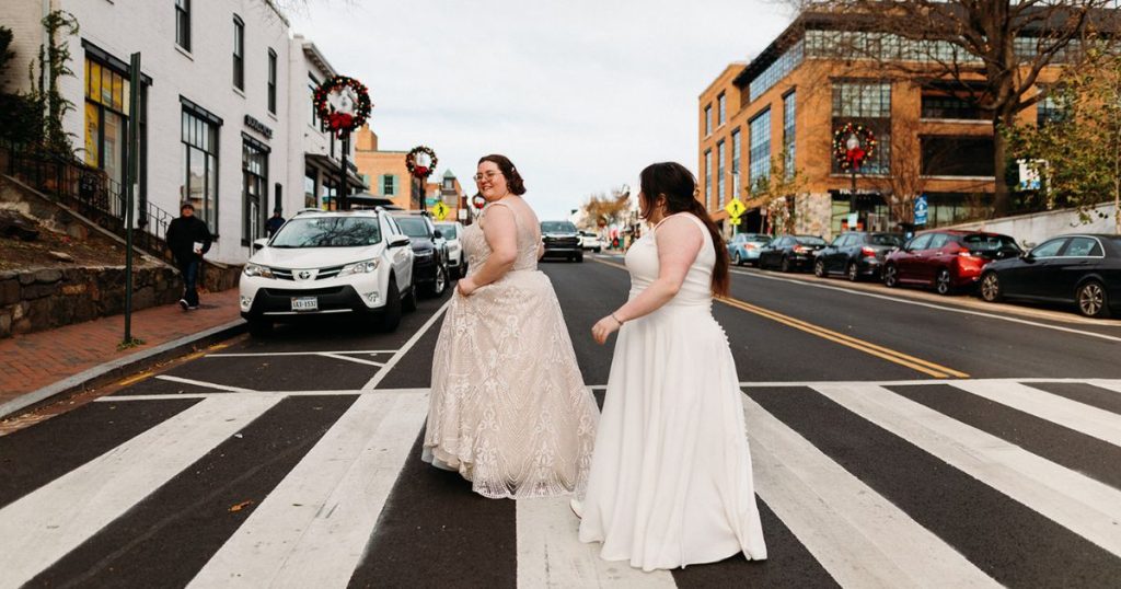 Brides walking hand in hand through Georgetown on their way to Pinstripes DC for their wedding