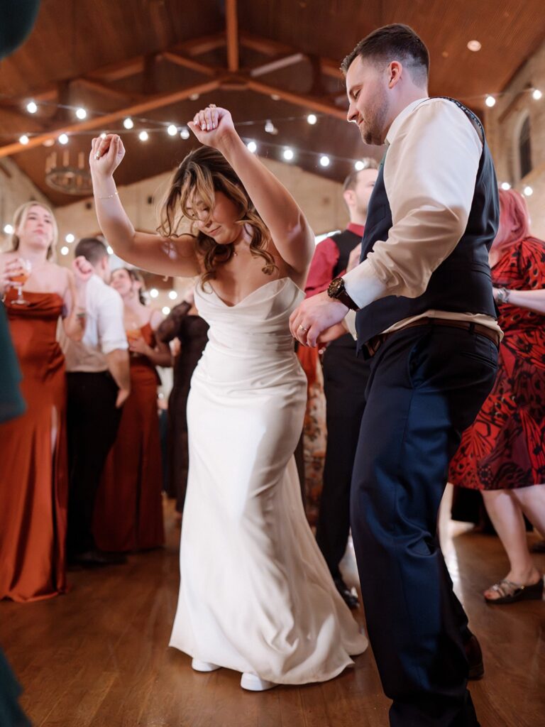 Bride dancing with her groom on the dance floor.