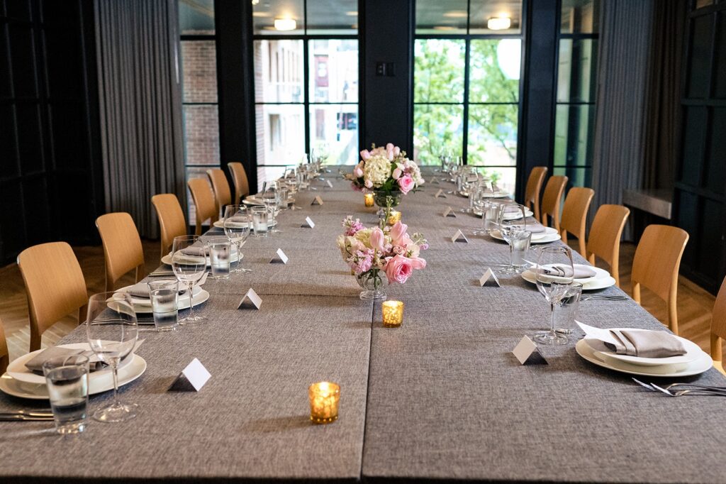 Wedding reception dinner service set up in a room at The Line DC Hotel.