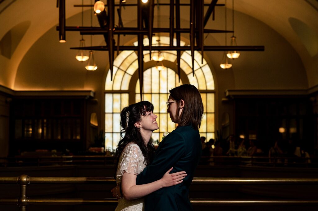 A wedding couple looks at each other in the lobby at The Line DC Hotel.