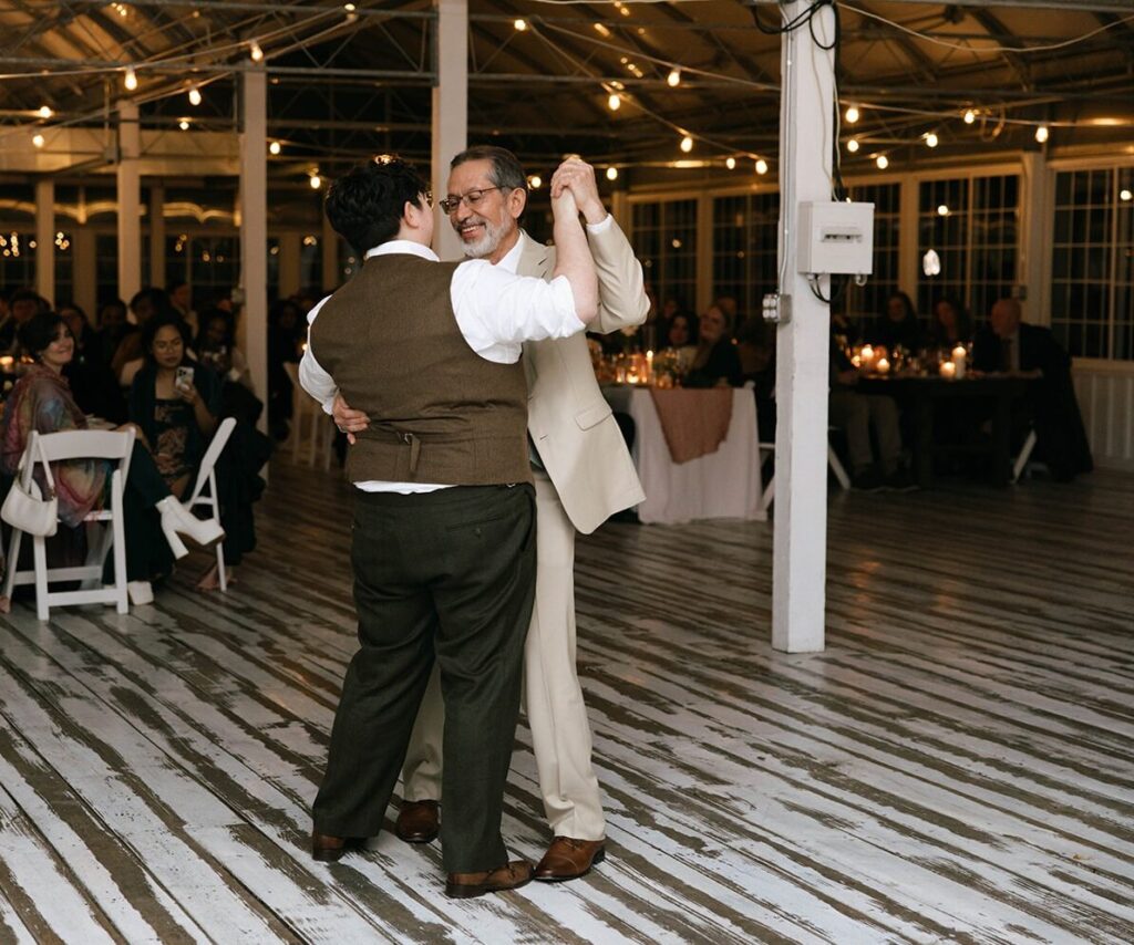 A spouse and their father dancing