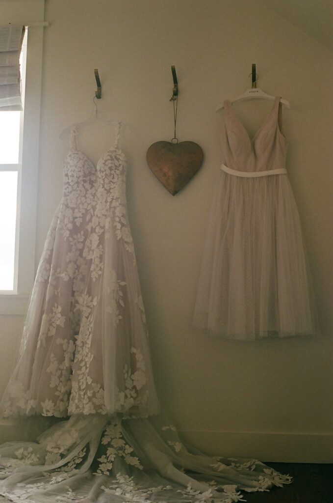 Two wedding dresses hanging in a room in the Showalter's Orchard and Greenhouse farmhouse