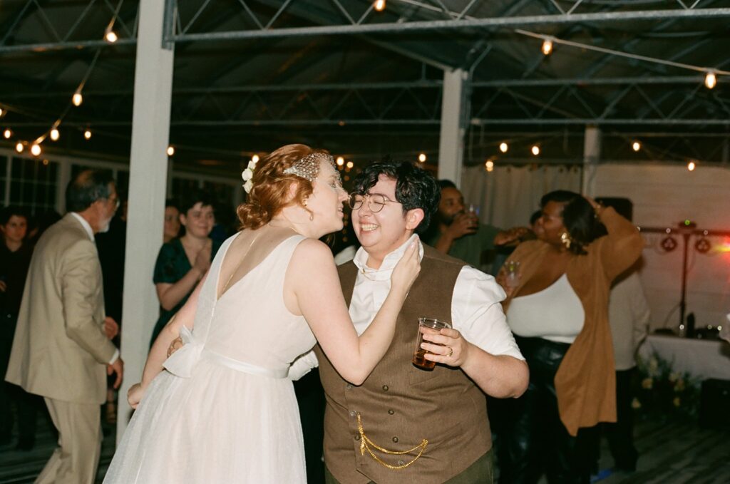 Film of a couple dancing at their wedding reception