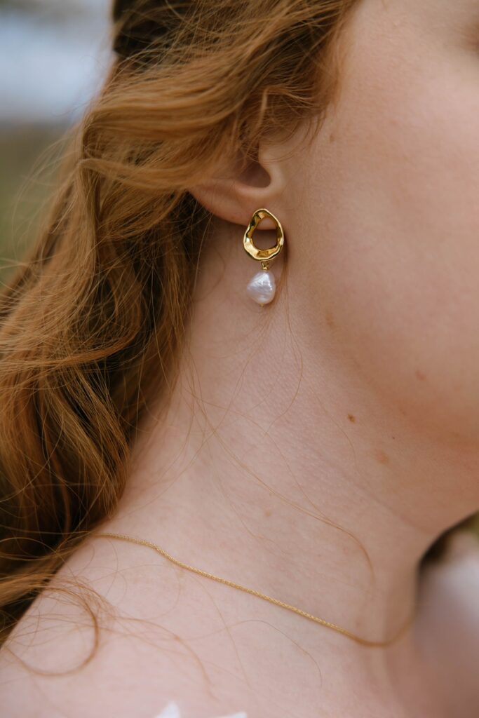 Up close jewelry details of a spouse-to-be at her Showalter's Orchard and Greenhouse Wedding