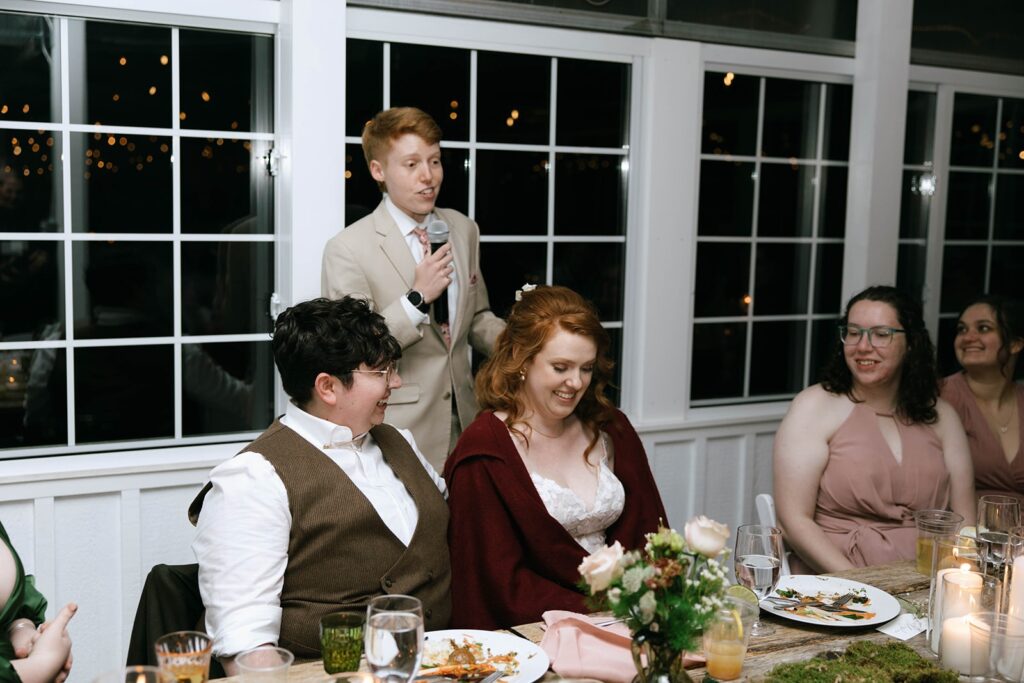 Loved ones sharing toasts at a couples wedding reception