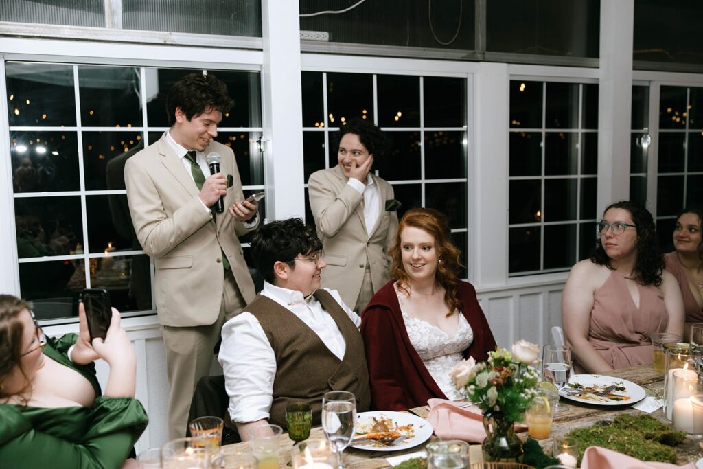 Loved ones sharing toasts at a couples wedding reception