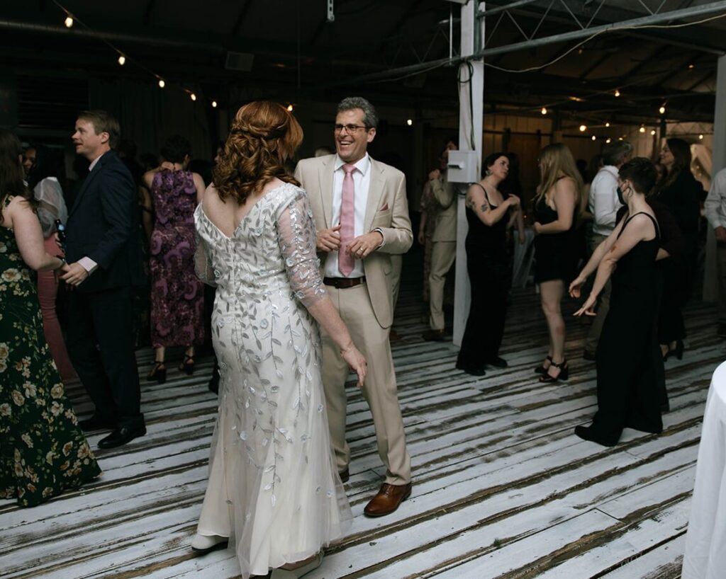 Family of the newlyweds dancing at the reception