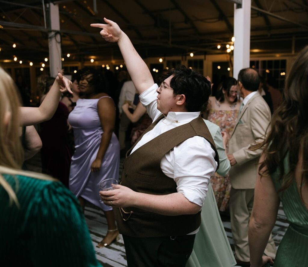 A spouse dancing at their wedding reception